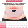 Electromagnetic therapy device on a person's abdomen with vibration mode options displayed.